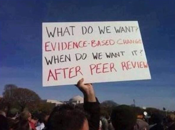 photo of poster at the march for science asking people to follow the evidence based peer review process